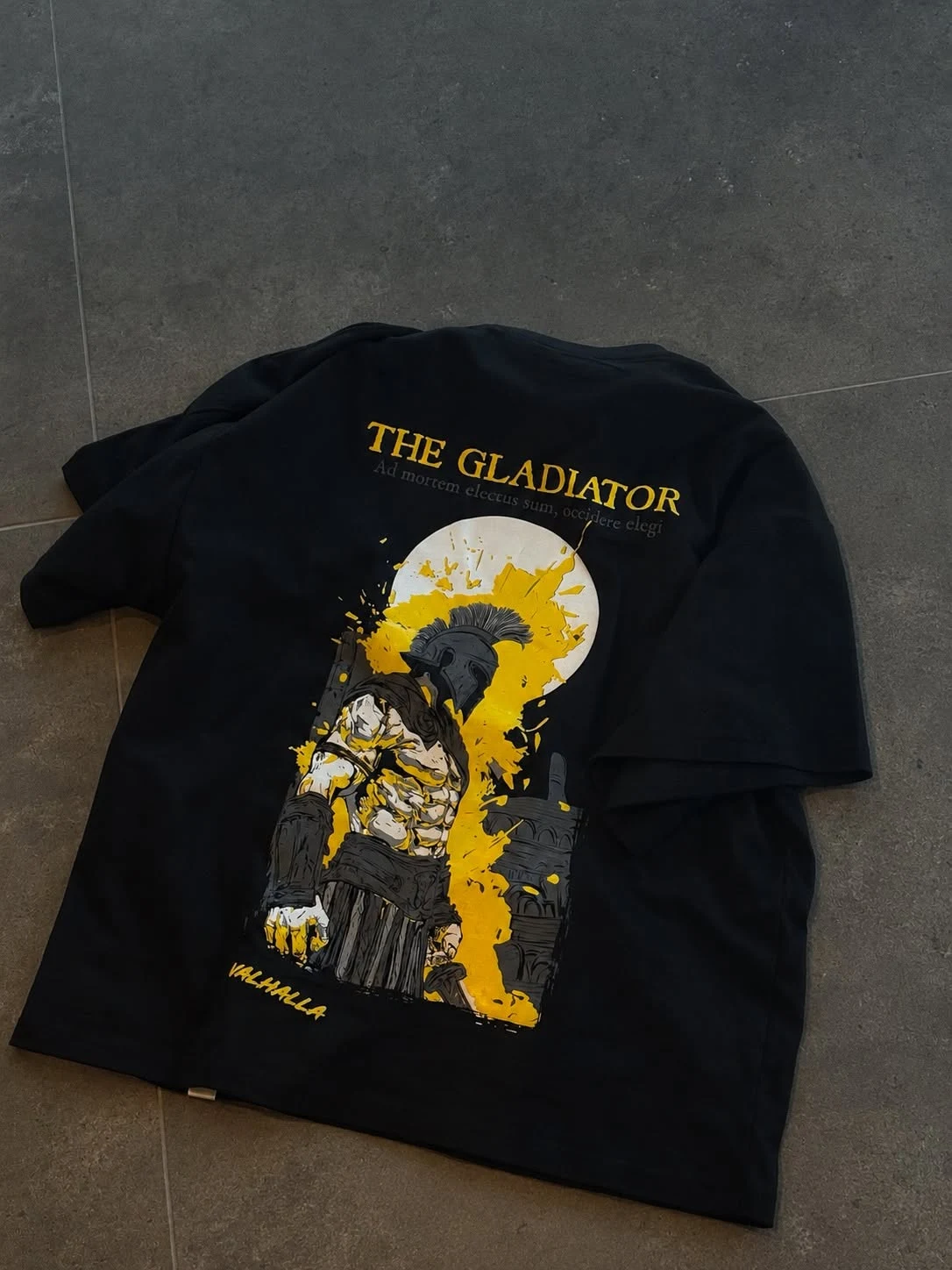 The Gladiator — original back artwork on the black oversized T-shirt