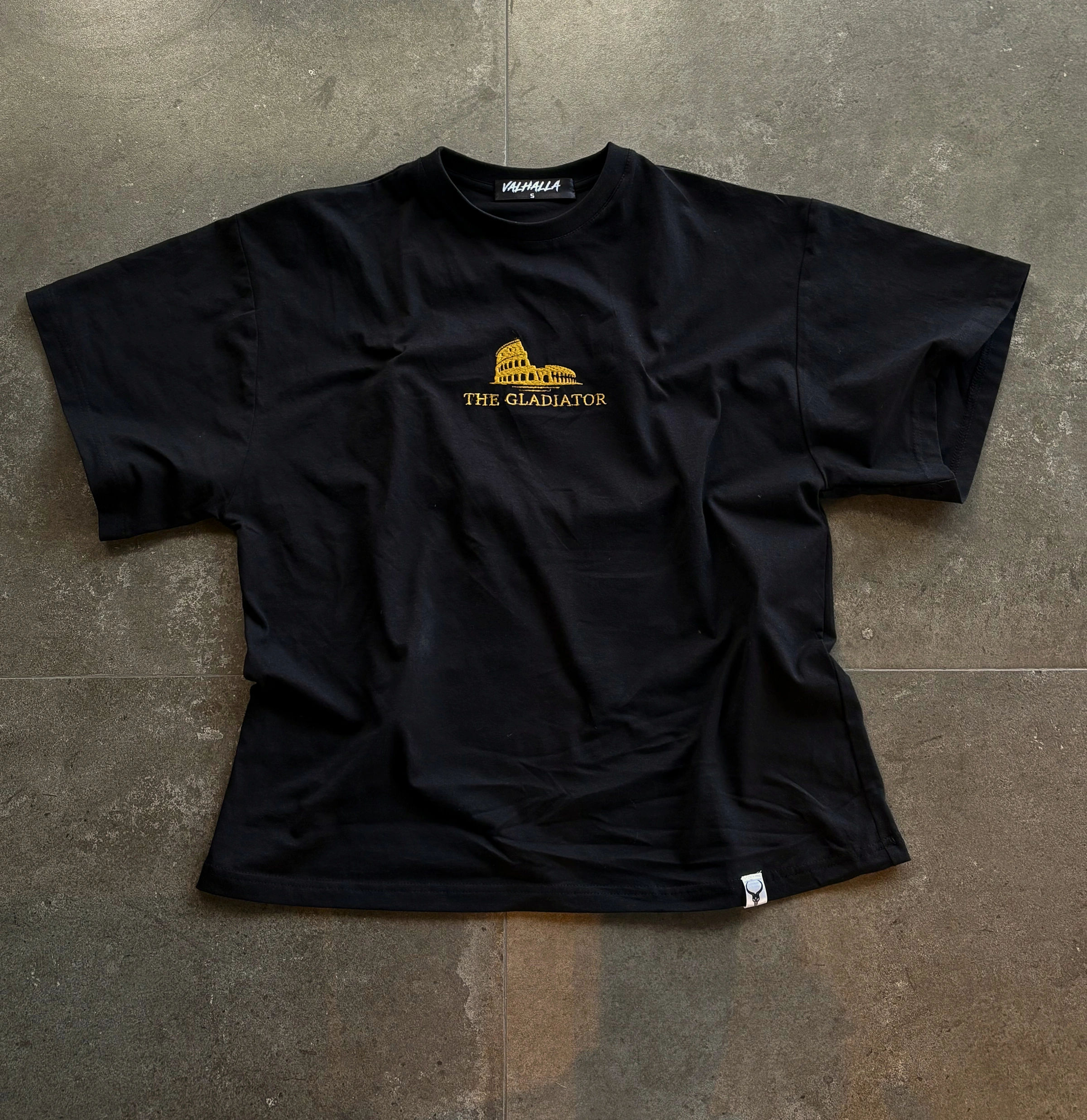 Original gold Colosseum embroidery on black fabric