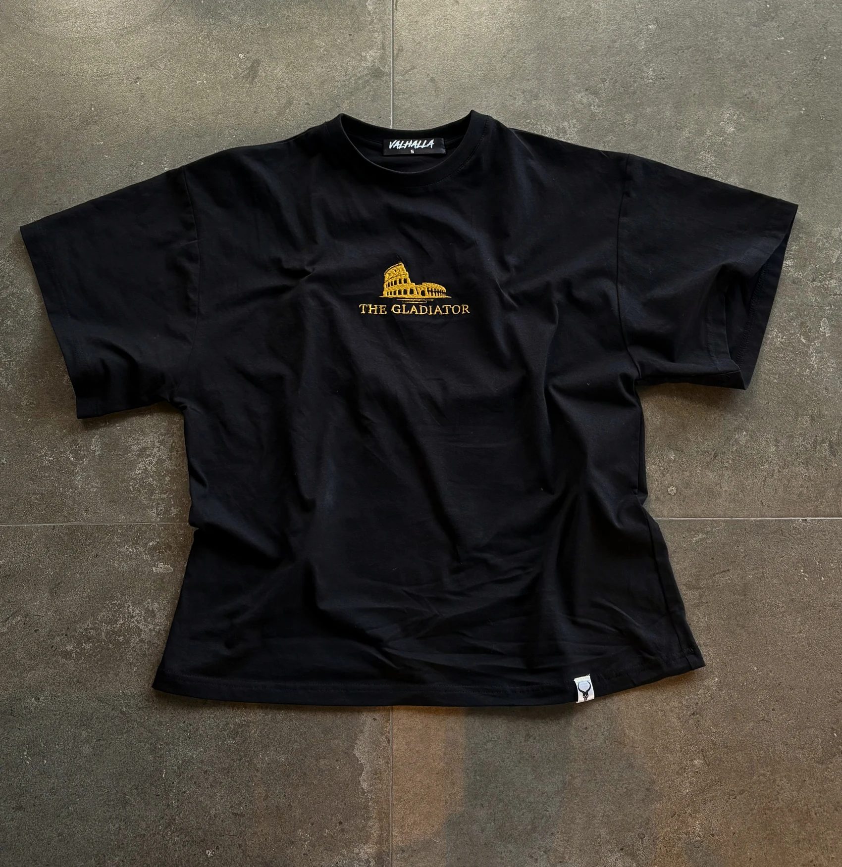 Front view with gold Colosseum embroidery